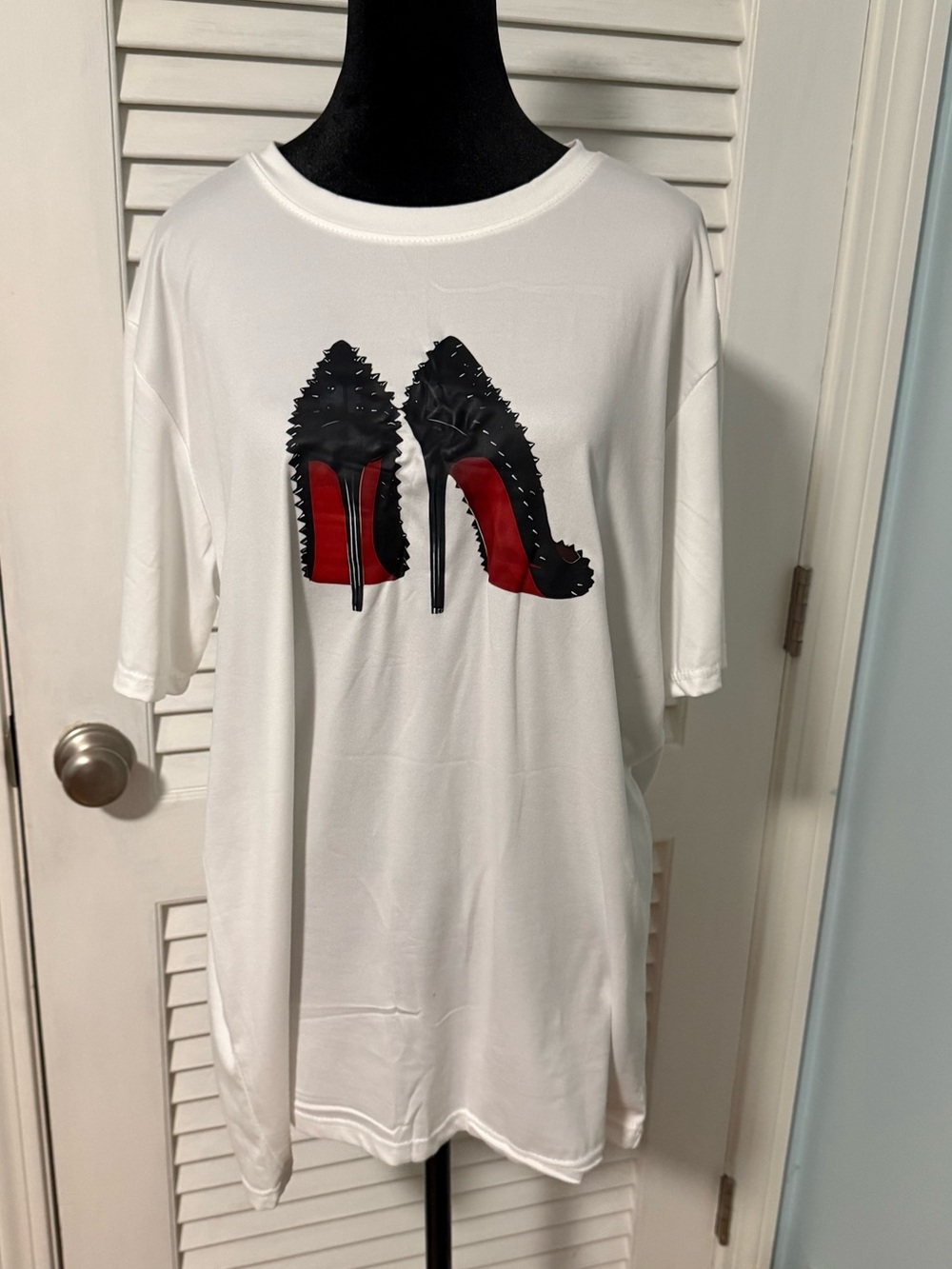 White Graphic Tee with Black Studded High Heel Print. Relaxed fit women’s L!